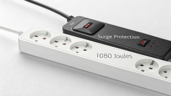 A side-by-side comparison of a simple power strip and a surge protector with joule rating visible