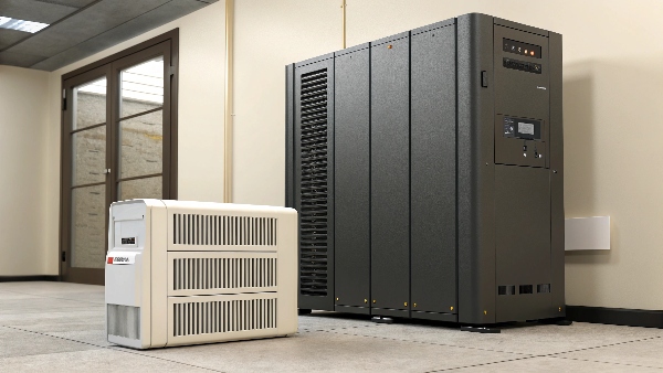 A small window heater unit with a very large, industrial UPS next to it, highlighting the disproportionate size needed