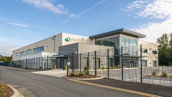 Exterior of a secure colocation data center facility with a company logo