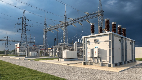 High-voltage electrical substation with multiple transmission lines, one set presumably feeding a data center