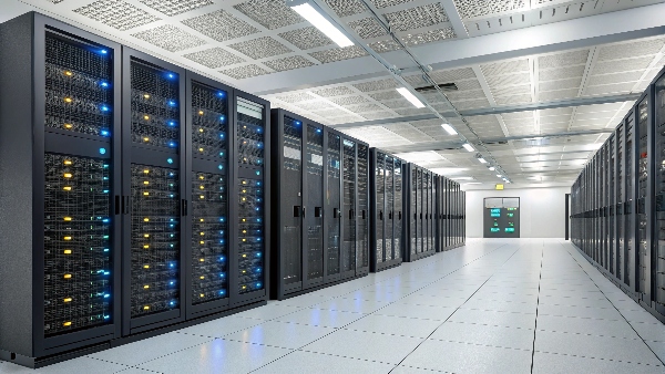Interior shot of a modern data center with rows of illuminated server racks